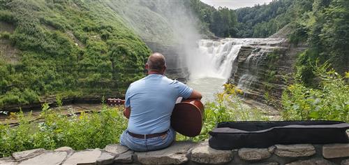 Learning guitar at my favorite waterfall. 