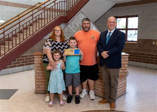Photo of Derrick Zappia, family members, and Assistant Principal Jeff Yonkers.