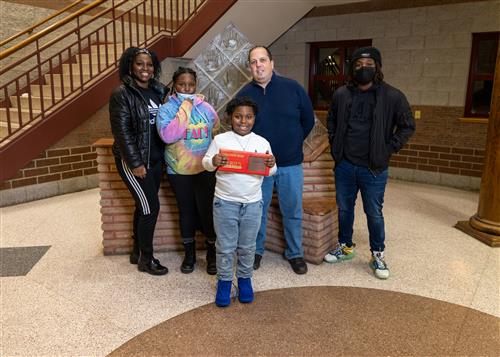 Photo of Perry Stairclimber Shaliel Glover and family members.