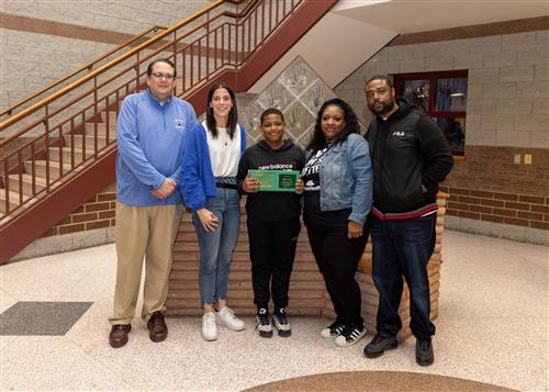 Photo of Pfeiffer-Burleigh's March Stairclimber, Key'von Kent, and family.