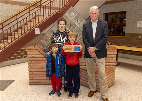 Daniel Austin, Diehl Elementary's December Stairclimber, with family and Principal Tim Sabol.