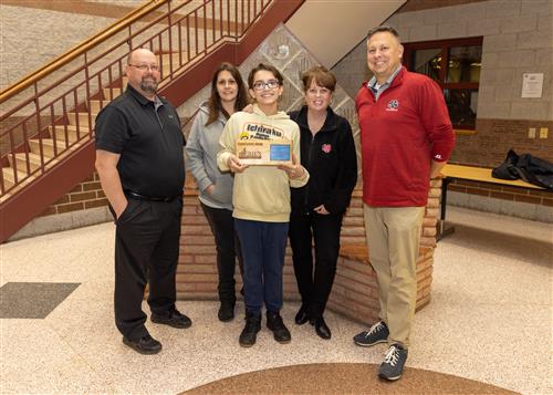 Owen Hartleb, Strong Vincent's December Stairclimber, poses with his plaque, family and school administrators.