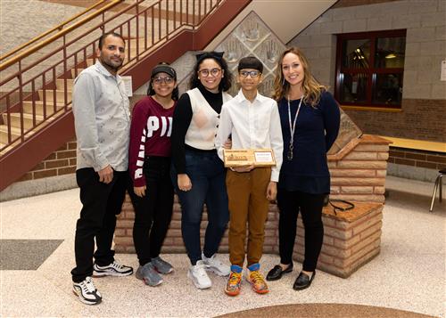 Eric LeBron Seda, Wilson's January 2023 Stairclimber, with family members and school staff.