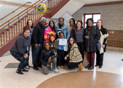 DeMarcus House standing with family and Edison faculty.