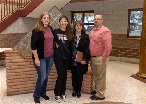 Jessica Urso, Strong Vincent Middle School's October 2022 Stairclimber, with family and school administrators.