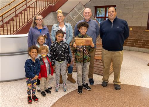 Perry's October 2022 Stairclimber, Parish Bishop, with family and school staff.