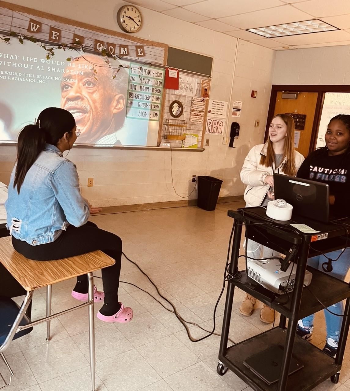 East Middle School students giving a presentation on Al Sharpton.
