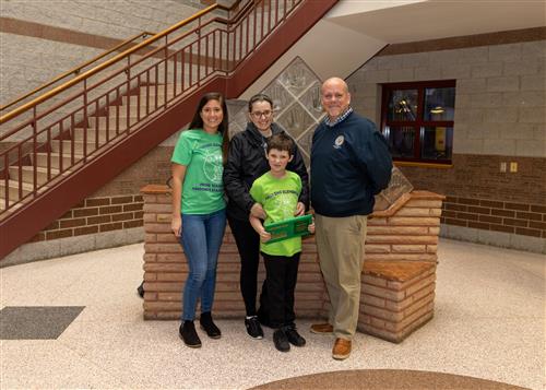 Photo of Harding's March Stairclimber, Mason Wilcox, and family.