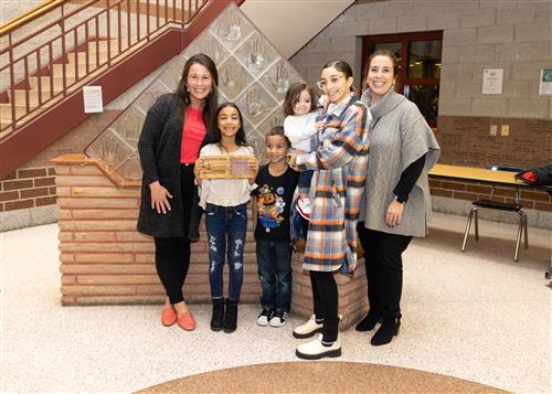 Edison Elementary's January Stairclimber De'Nyla Barnes poses with family and school admins.